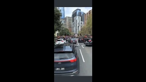 Melbourne police chased by protesters