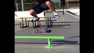 Half Cab Flip over a Bar