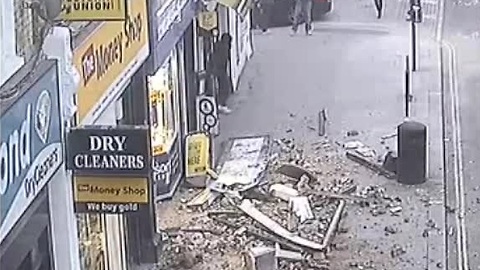 CCTV captures roof collapse on busy London street