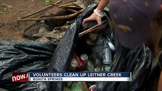 Volunteers clean up trash along Leitner Creek