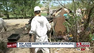 Rep. Cindy Axne helps clean up efforts in Pacific Junction