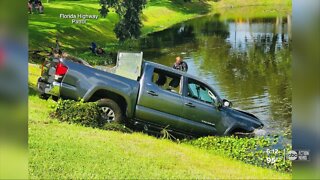 Driver dies at hospital after pickup truck sinks into pond