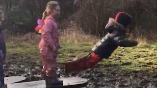 Boy falls face-first in puddle of mud!