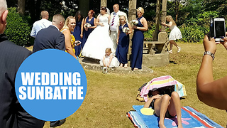 A shameless sunbather photobombs happy couple's wedding pictures