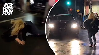 Woman flies through the air after being hit by car doing donuts