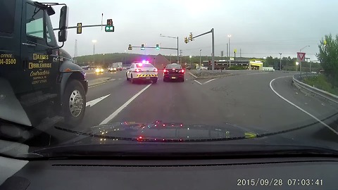 Truck Runs A Red Light In Front Of Cops And Gets Instant Karma