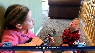 Toddler learning to speak by singing along to music