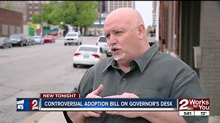 Controversial adoption bill on governor's desk