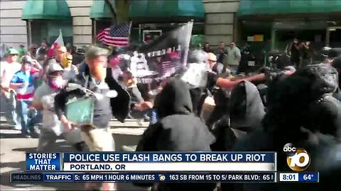 Police use flash bangs to break up riot