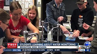 Students learning about water monitoring