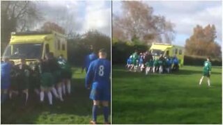 Rival soccer teams join together to free an ambulance stuck in the mud