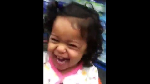 Toddlers laugh hysterically during shopping cart ride