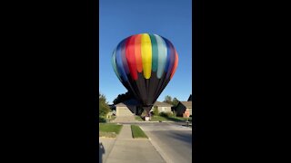 Hot air balloon lands in Omaha neighborhood (1/2)