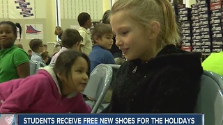 Students receive new shoes for holidays