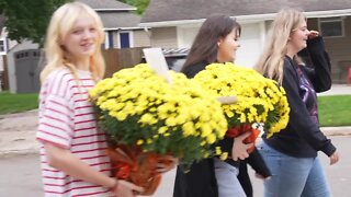 Relevant Academy celebrates Good Neighbor Day by handing out flowers to community members