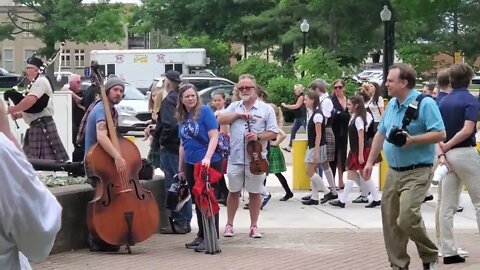 Bagpiper leading the Irish Ceili dancers to the square at Vandalia Gatherind, Charleston, WV.