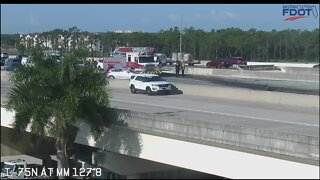 Truck overturns on I-75 overpass