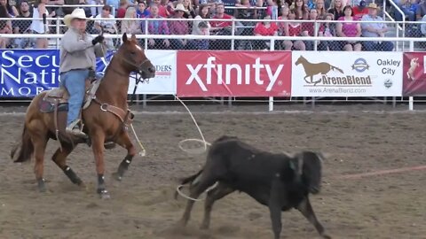 Editorial coboys team roping at a PRCA rodeo event