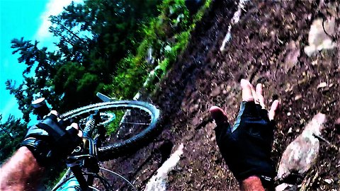 Mountain biker performs flawless tuck-and-roll wipe out