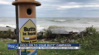 Volunteers pick up cigarette butts along Lake Michigan