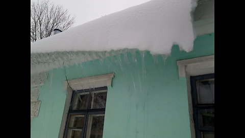 Snow and ice sliding down from the roof