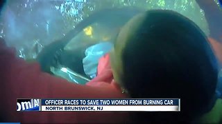 Officer, others save women from burning car