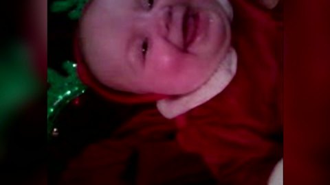 "Adorable Baby in Christmas Antlers Laughing"