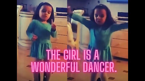 The girl dances very beautifully. She put on her mother's shoes.