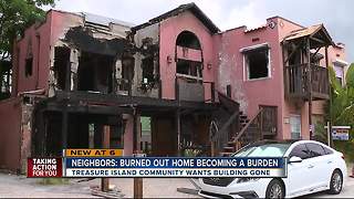 Burned-out home now burdening Treasure Island community