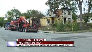 Man's body found in basement of burned out home