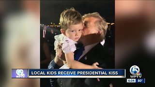 Local kids receive presidential kiss