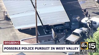 RAW: Police draw guns after pursuit ends in crash