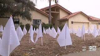 Tempe home displays white flags for those lost to COVID-19