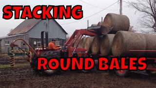 Stacking round bales