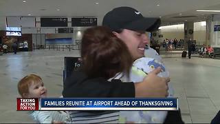 Families reunite at airport ahead of Thanksgiving