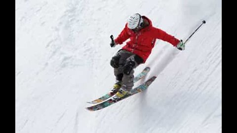 Skier completely helpless as he slides off hillside