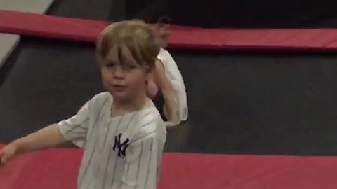 Little Boy Tries To Do Flips on Trampoline But Fail