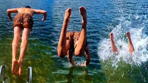 Slow motion running dive into cool Quebec lake