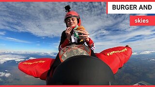 Amazing footage shows skydiver tucking into a burger