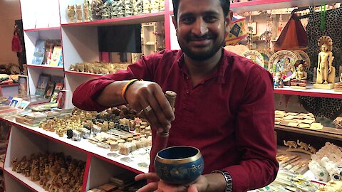 Mysterious singing bowl demonstrated by shop owner in India