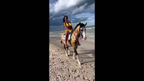 Horseback riding on Thai beach.