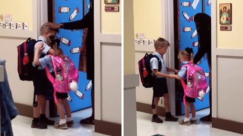 Big Brother Gives His Sister A Comforting Hug Before School