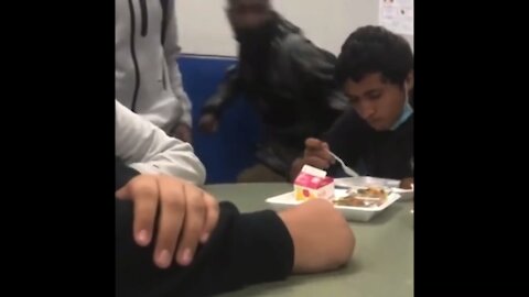 Small male student quietly eating at school suddenly beaten into ground by two males. Sept 2021