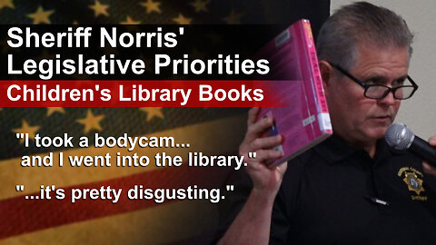 Sheriff Norris goes into the library to examine the children's materials