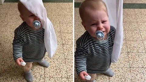 Dramatic baby cries when 'trapped' under bedsheet