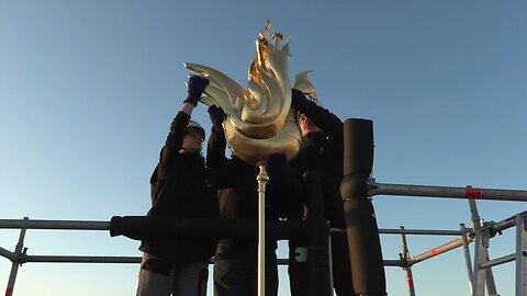 Golden rooster fitted to spire of Paris's Notre Dame cathedral