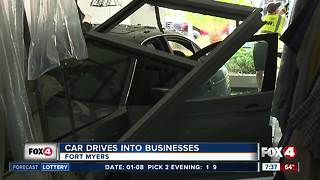 Car crashes through building into two businesses