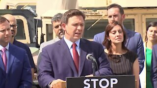 Florida Gov. Ron DeSantis speaks at National Guard armory in Miami