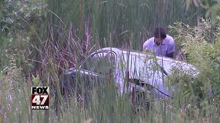 Police investigating car crash into pond