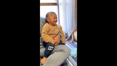 Baby laughing hysterically